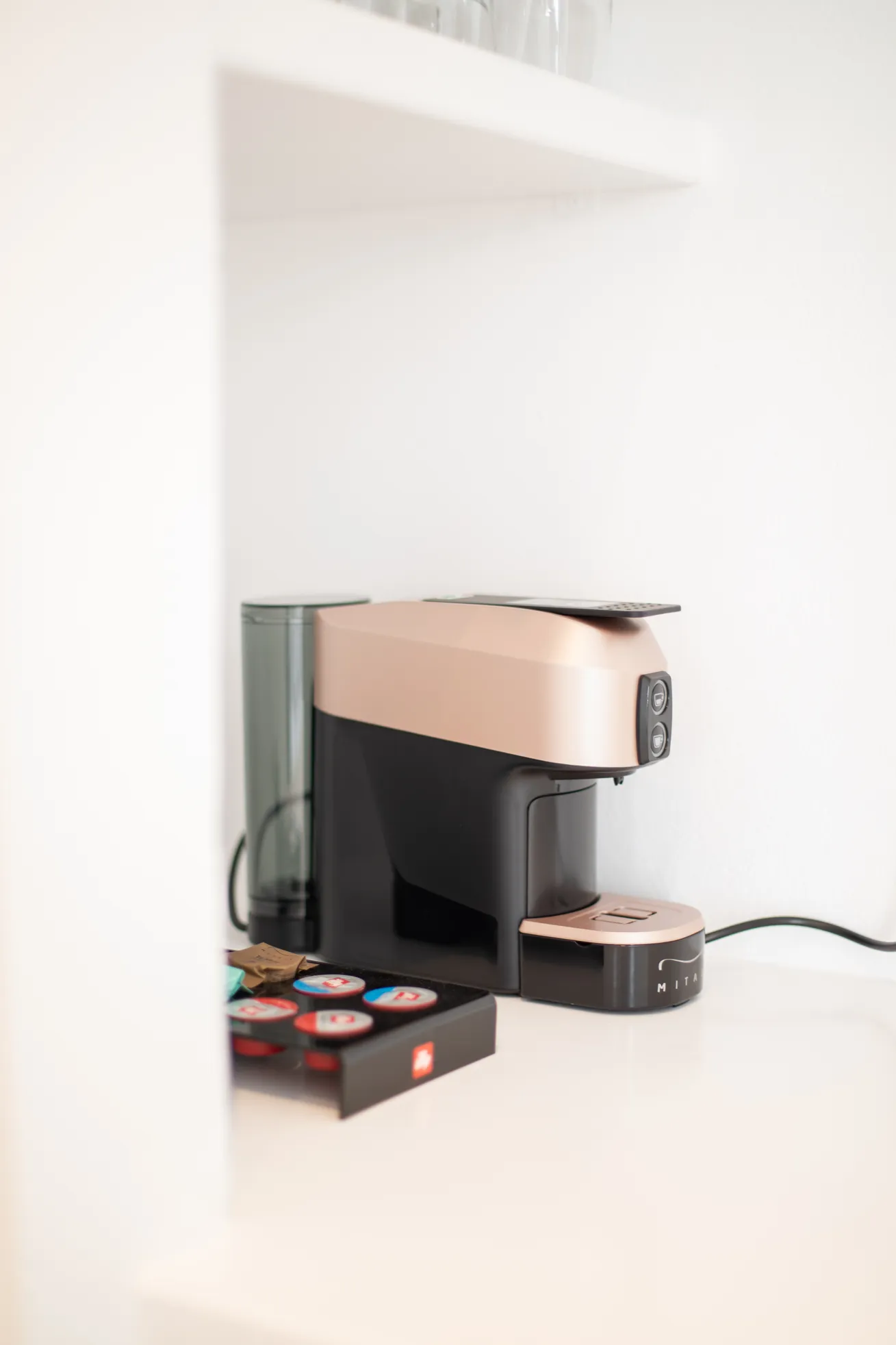 Espresso machine in the kitchenette niche